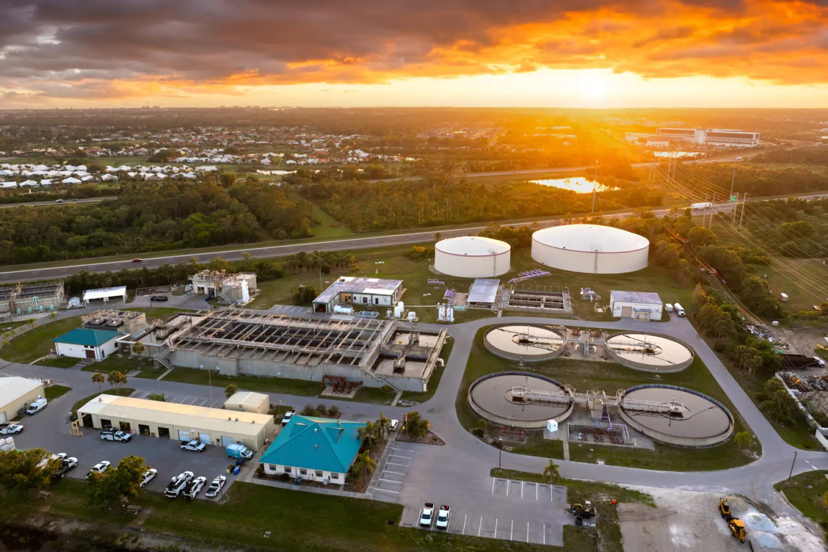 Water treatment plant at sunset, aerial view.