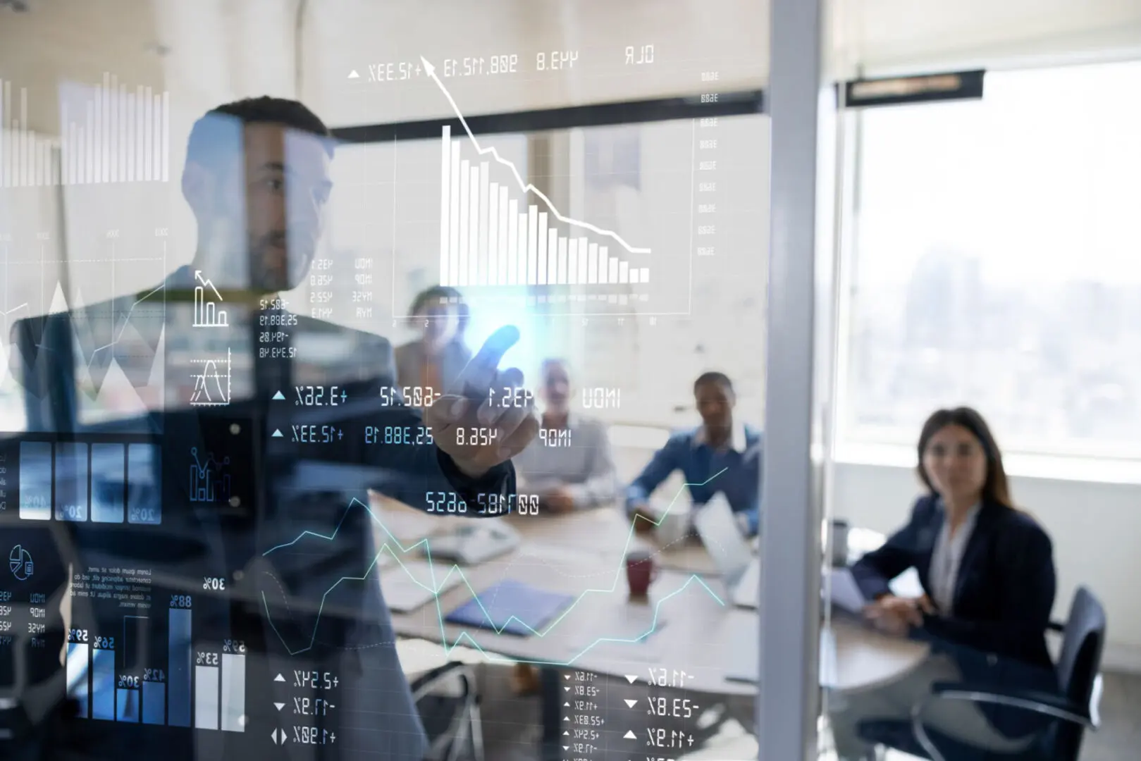 Team reviewing digital financial dashboard on glass